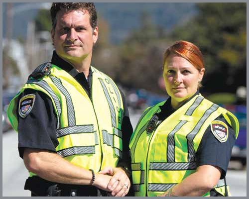 Two police officers with safety reflective vests