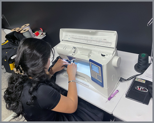 Seamstress working on sewing machine