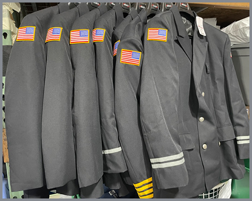 Fire department uniform coats hanging
